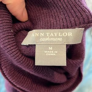 Purple/maroon cashmere turtleneck sweater.
